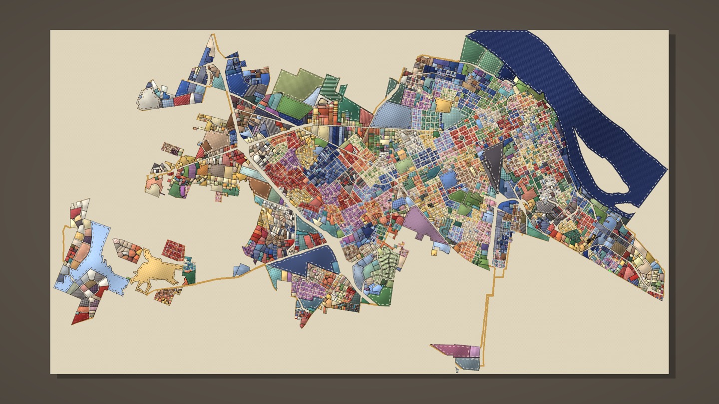 All of Paducah as a quilt on a gallery wall, the Ohio in indigo, the city line bound in gold