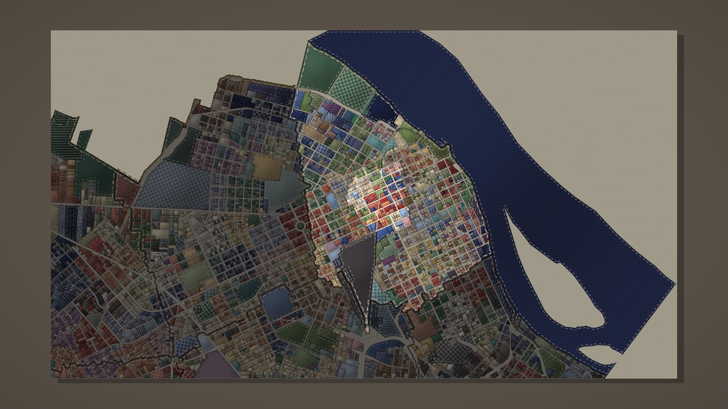 A part of town picked out, one neighbourhood lit and stitched round, the rest of the city dimmed