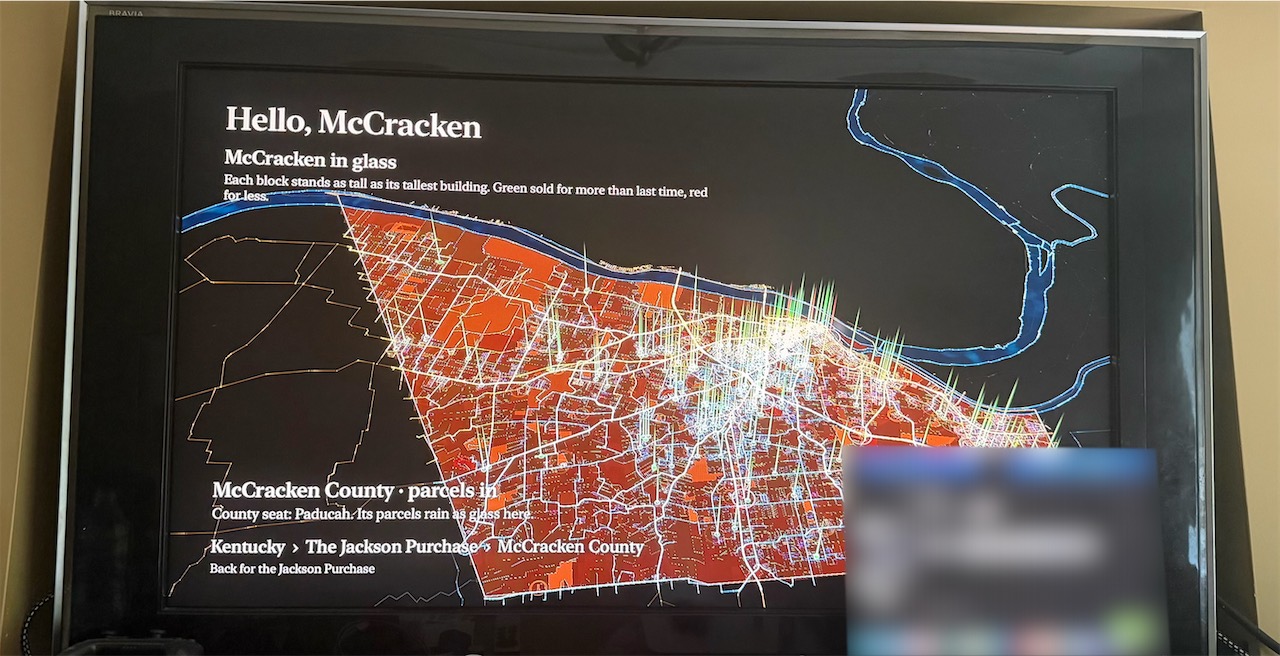 The Apple TV showing Hello, McCracken over the county in glass